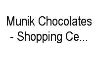 Logo Munik Chocolates - Shopping Center Norte em Vila Guilherme